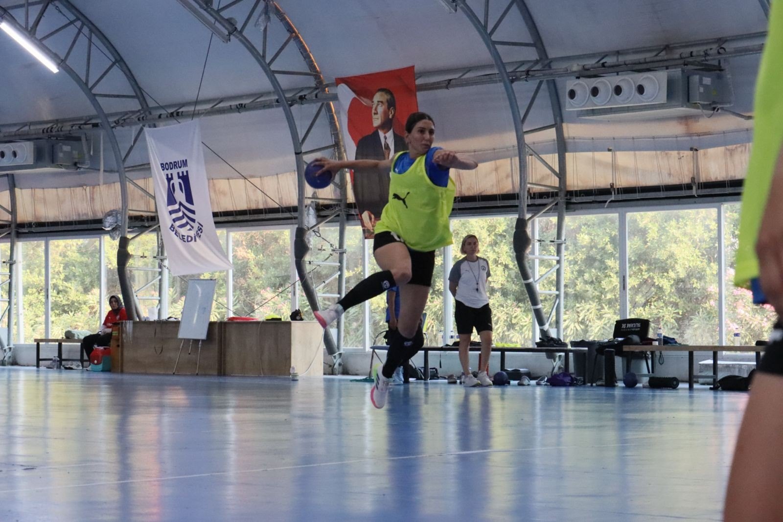 A player leaps to shoot during pre-season training